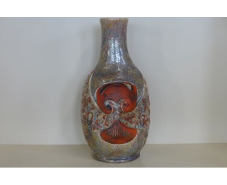 A West German pottery lamp base in orange and brown, unusual pierced and pinched form, height 55cm, underside marked 3290/55 