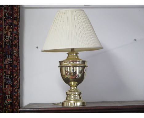 A lacquered brass table lamp with shade, 64cm tall 