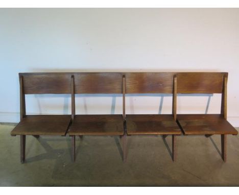 A good quality early four seater 20th century oak church bench which can fold flat, 210cm  - in sound usable condition 