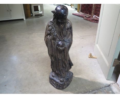 A ceramic figure of an oriental immortal 81cm tall 