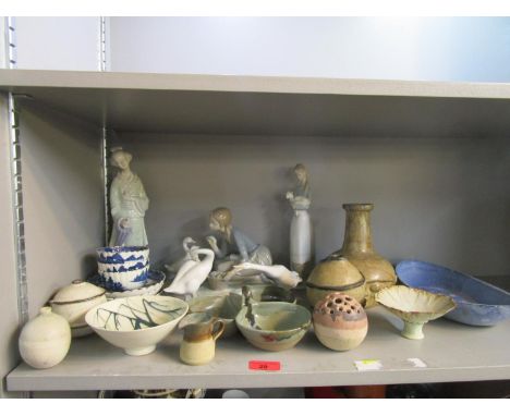 A group of Lladro porcelain figures, Caughey blue and white tea bowls and a selection of studio pottery 
