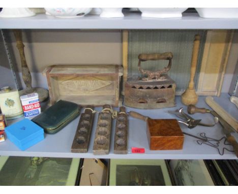 Vintage treen chocolate mould and vintage treen kitchen items to include a washboard, a Victorian iron, together with 20th ce