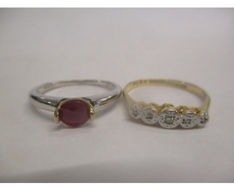 An 18ct gold and diamond ring and a 9ct white gold ring set with a ruby 