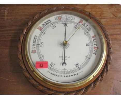 A Victorian oak framed circular wall android barometer, Kirk &amp; Co Ltd, Hull 