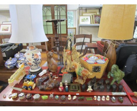 A mixed lot to include a pair of 19th century leather child's slippers, table lamps, vintage toys, daguerreotype photographs,