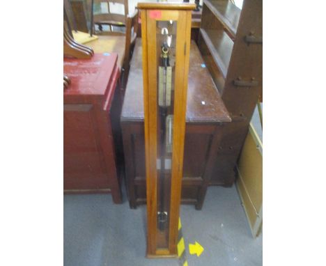 A Baid &amp; Tatlock Fontain type barometer on a hardwood plaque in a later mahogany glazed cabinet, 50 1/2"H x 7 1/4"w 