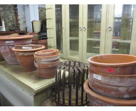 A quantity of terracotta garden pots, together with a vintage cage planter 