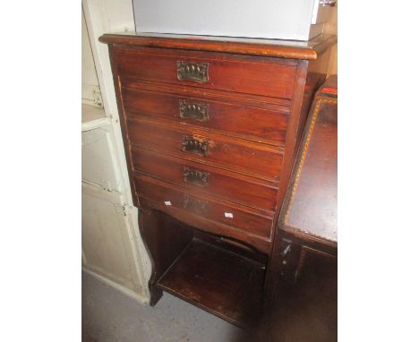 A Victorian mahogany music cabinet having five drawers with an open shelf below 40"h x 19 1/4"w 