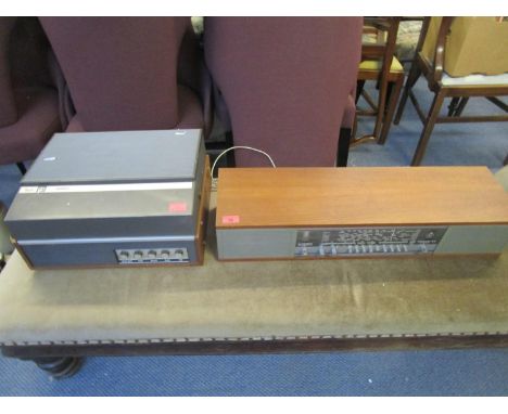 A Bang and Olufsen Beomaster 900 amplifier and a Phillips reel to reel tape recorder 