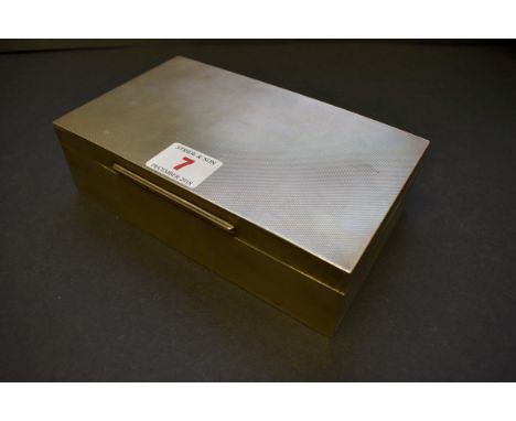 A silver rectangular engine turned cigarette box,&nbsp;by E S C,&nbsp;Birmingham 1974, 18cm x 10.5cm, 705g all in. 
