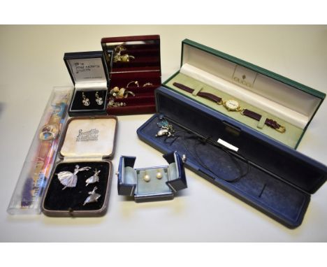 A quantity of costume jewellery, to include a silver ballerina brooch with matching earclips; and a cased Swatch watch. 