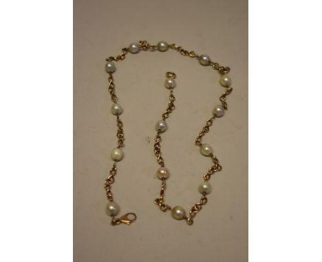 A 9ct gold chain and pearl necklace, 54cm. 