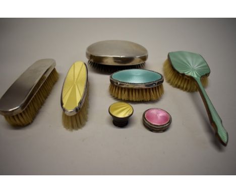 Three silver and enamel backed brushes; together with two silver examples; and two silver and enamel lids. 