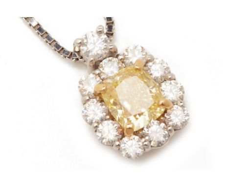 A YELLOW AND WHITE DIAMOND PENDANT ON CHAIN
Set in 20k white gold and platinum, the cushion cut fancy intense yellow diamond 