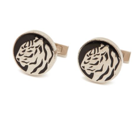 A PAIR OF SILVER AND ENAMEL TIGER CUFFLINKS
With a design of a tiger's head, fixed bar, marked 925 and signed Cartier
1.8cm d