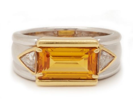 A YELLOW SAPPHIRE AND DIAMOND RING BY YOSHIHIKO OKUMURA
Set in platinum and 18k yellow gold, the step cut yellow sapphire fla