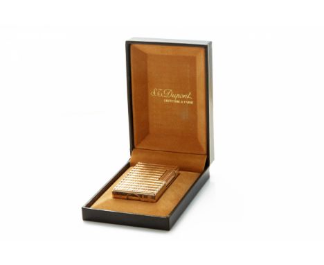 AN S.T. DUPONT GOLD PLATED LIGHTER
Numbered 81FBA48. Made in Paris, France
With original box
5.7cm high x 3.4cm long x 1.1cm 