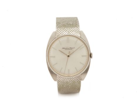 AN IWC STAINLESS STEEL BRACELET WATCH
Circa 1980s 
Stainless steel case and integral bracelet mesh strap, manual wind movemen