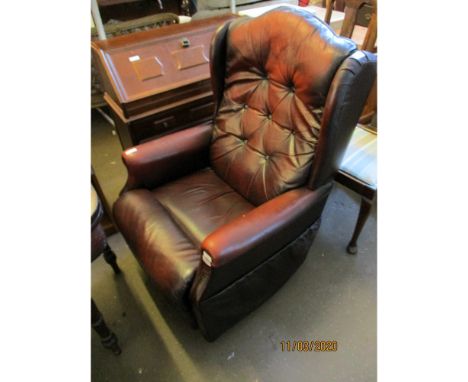 AN OX-BLOOD LEATHER AND BUTTON BACK RECLINER LAZYBOY ARMCHAIR