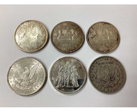 Collection Of Six Silver Coins, including two USA 'Morgan' Dollars, three Canada 1 Dollars and a 1973 10 Francs, total weight