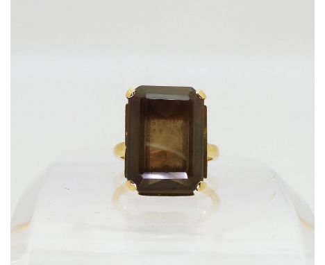 An 18ct gold smoky quartz ring, with a pierced basket setting, size L1/2, weight 8gms Condition Report:Available upon request