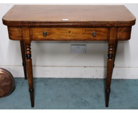 A Victorian mahogany and satinwood inlaid fold over card table with fold over top concealing green baize play surface over si
