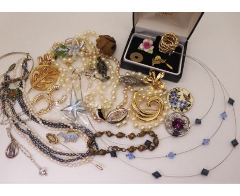 A silver Celtic knotwork bangle set with an amethyst, a Mackintosh style brooch a Thierry Mugler star brooch and other items 