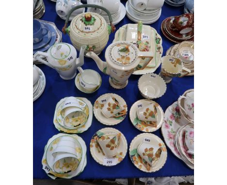 An Art Deco Burleigh Ware Meadowland coffee set, together with a Gladstone China Art Deco part coffee set and A.J. Wilkinson 