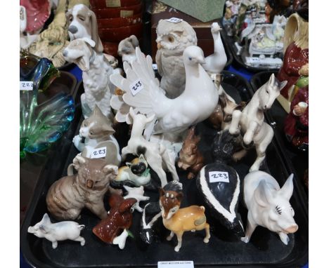 A collection of animal and bird figures including Beswick skunk, Babycham fawn, Koala, pig, Nao dogs etc Condition Report:No 