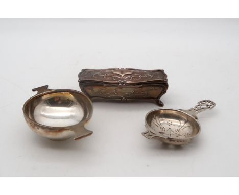 A silver strainer, by Mappin &amp; Webb, London, a small silver quaich, by C T Burrows, Birmingham, and an Art Nouveau silver