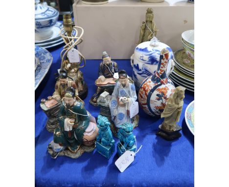 A collection of ceramics including Chinese figures of scholars, two carved hardstone figures of Guanyin, an Imari bottle vase