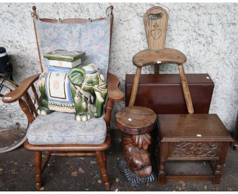 A mixed lot to include elm rail back arm chair, ceramic elephant garden jardiniere, carved koi occasional table, elm milking 