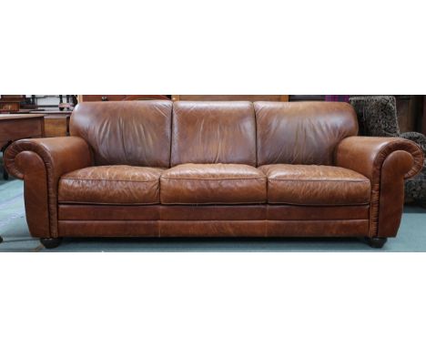 A contemporary Italian leather upholstered three seater sofa on turn feet, 85cm high x 233cm wide x 105cm deep Condition Repo