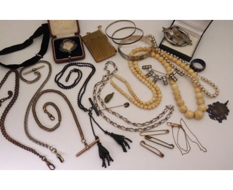 A collection of base metal fob chains to include a black mourning example, a wide silver bangle, bone beads and other items o
