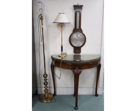 A 20th century walnut veneered demilune fold over table, oak barometer thermometer, brass standard lamp and a brass based tab