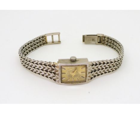 A 9ct white gold ladies Rotary quartz watch with decorative herringbone strap, weight with mechanism 23.1gms Condition Report