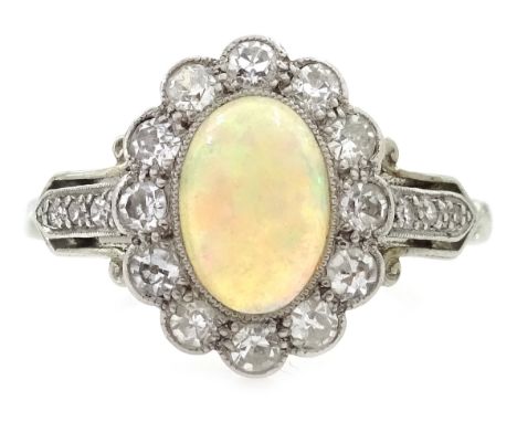 Early 20th century rim set opal and diamond cluster ring, with diamond shoulders Condition Report Approx 3.2gm, size M-N, rin