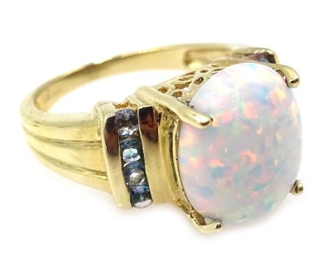 9ct gold opal ring with blue topaz shoulders hallmarked Condition Report size N4.9gmClick here for further images, condition,