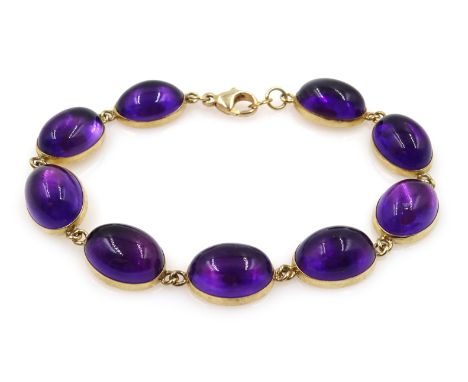 Gold cabochon amethyst link bracelet, hallmarked 9ct Condition Report Approx 16.4gm, length = 18cm Click here for further ima