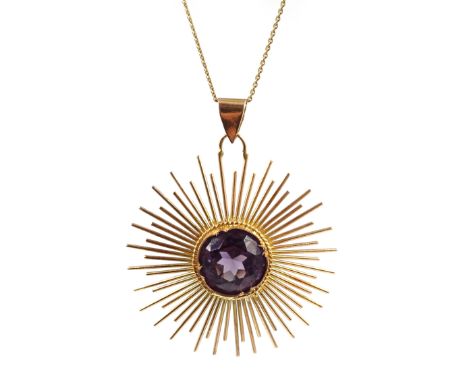 Gold amethyst set sunburst pendant stamped 18 on chain  Condition Report Pendant approx 6.4gm, length = 4.5cm Click here for 