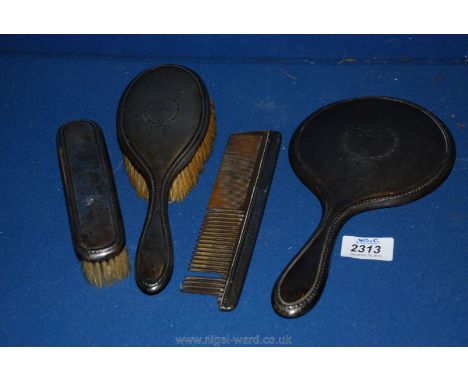 A Silver dressing table set including mirror, comb, brush, etc.