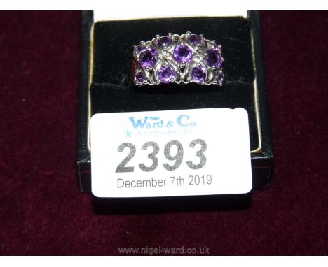 A 9ct white gold Ring set with amethysts