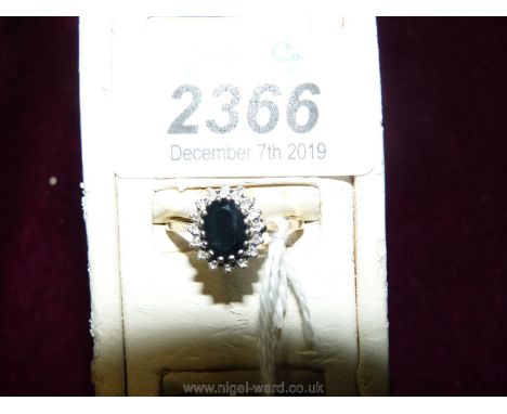 A 9 ct. sapphire and diamond Ring, size "P", hallmarked.