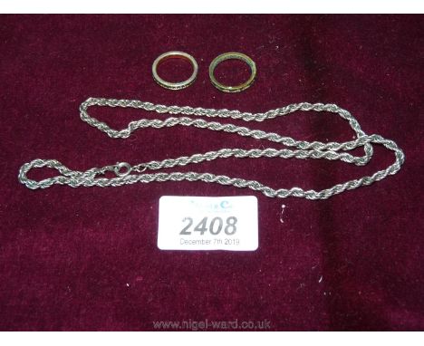 A costume jewellery white metal rope twist neck Chain, 23'' long approx. and two eternity style Rings, set with small 'stones