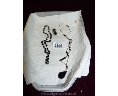Two black Necklaces and similar ring.