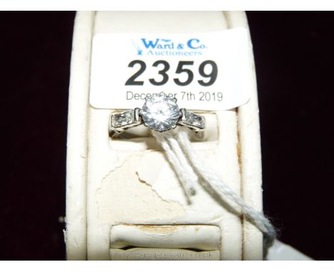 A white gold Cubic Zirconia Ring set with three stones. Ring size "P".
