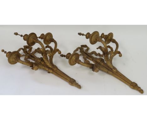 A pair of 19th Century Neo classical carved gilt wood wall light sconces, each with three arms, ribbon and bow supports and f