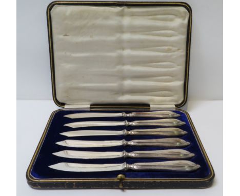 A cased set of silver handled fruit knives together with loose silver & other spoons, fobs & a George III sauce ladle London 
