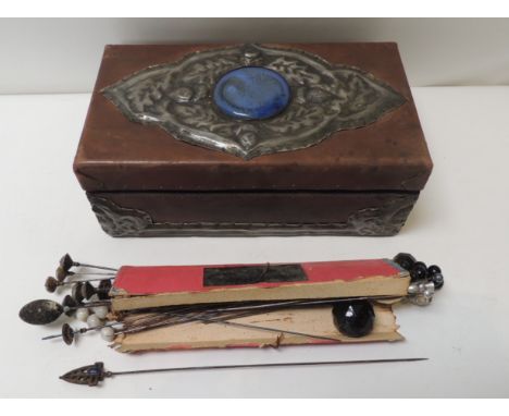 A collection of hatpins circa 1900-1910, includes paste set examples, black glass tops & others together with an Arts & Craft