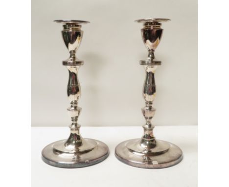 A pair of 18th Century Sheffield plate candlesticks of Neo Classical design, with detachable sconces, marked "Dan Holy Wilkin